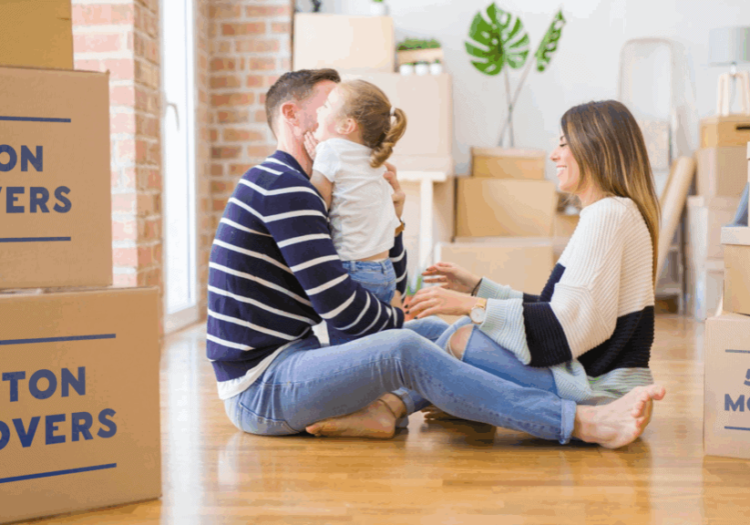 young family with boxes